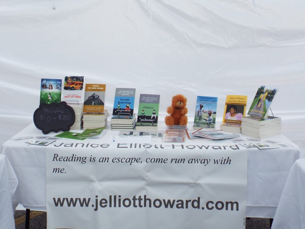 How to participate in a vendor event shows a table setup at Music Festival in Union City, Georgia. Books and brochures with a banner.
