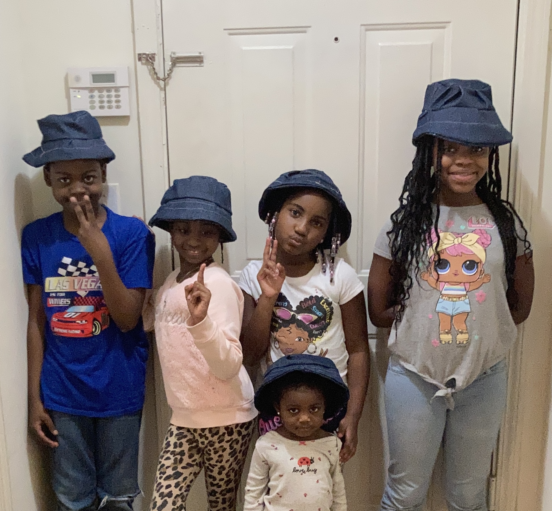 Children wearing hats that they made